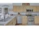 Functional kitchen featuring stainless appliances, light wood cabinets, and stylish countertops at 40 Butler Bridge Dr, Mcdonough, GA 30252
