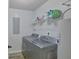 A tidy laundry room featuring a washer, dryer, and storage shelf at 40 Butler Bridge Dr, Mcdonough, GA 30252