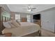 A comfortable main bedroom with a ceiling fan, and a TV on a dresser at 40 Butler Bridge Dr, Mcdonough, GA 30252