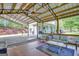 Inviting outdoor patio with comfortable seating, a ceiling fan, and wood flooring, ideal for relaxation at 40 Butler Bridge Dr, Mcdonough, GA 30252