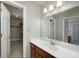 Bathroom showcasing a single sink vanity and an open walk-in closet at 173 Darwish Dr, Mcdonough, GA 30252