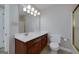 Bathroom features a single sink vanity with a large mirror and a nearby toilet at 173 Darwish Dr, Mcdonough, GA 30252