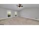 Bright bedroom with neutral carpet and large windows at 173 Darwish Dr, Mcdonough, GA 30252
