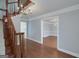 Spacious foyer with hardwood floors, staircase, chandelier, and neutral gray walls at 173 Darwish Dr, Mcdonough, GA 30252