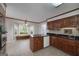Eat-in kitchen featuring dark granite counters, tile floors, and a charming bay window with bench seating at 173 Darwish Dr, Mcdonough, GA 30252
