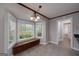 Bright breakfast nook with large windows, built-in bench seating, and a view of the green outdoors at 173 Darwish Dr, Mcdonough, GA 30252