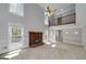 Bright living room features a fireplace, large windows, and access to the deck at 173 Darwish Dr, Mcdonough, GA 30252