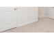 A bright bedroom featuring neutral carpet, white walls, and crisp white trim at 295 Limestone Circle, Conyers, GA 30013