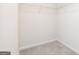 Walk-in closet featuring neutral carpet and white wire shelving at 295 Limestone Circle, Conyers, GA 30013