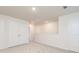 Hallway with neutral carpet, access to closets, and interior doors at 295 Limestone Circle, Conyers, GA 30013