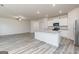Open concept kitchen featuring a granite island, stainless appliances, and ample cabinet space at 295 Limestone Circle, Conyers, GA 30013