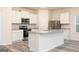 Kitchen with stainless steel appliances, granite countertops and an island at 295 Limestone Circle, Conyers, GA 30013