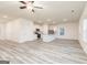 Spacious open-concept kitchen and living room area with stainless appliances and luxury vinyl tile at 295 Limestone Circle, Conyers, GA 30013