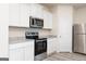 Bright kitchen with stainless steel appliances, ample cabinetry, and modern countertops at 295 Limestone Circle, Conyers, GA 30013