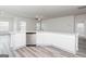Kitchen featuring white cabinets, stainless steel dishwasher, and a curved granite breakfast bar with sink at 299 Limestone Circle, Conyers, GA 30013