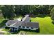 Sprawling ranch-style home featuring an attached garage, lush lawn and wooded surroundings at 395 Moss Ferry Rd, Villa Rica, GA 30180