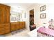 Well-lit bathroom features a double sink vanity with wooden cabinets and a separate vanity area at 395 Moss Ferry Rd, Villa Rica, GA 30180