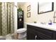 Modern bathroom features a dark vanity, shower with curtain, and tasteful decor at 395 Moss Ferry Rd, Villa Rica, GA 30180