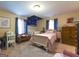 Charming bedroom featuring a crib, bed, and closet space with plenty of natural light at 395 Moss Ferry Rd, Villa Rica, GA 30180