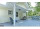 Covered deck with seating for outdoor dining and relaxing at 395 Moss Ferry Rd, Villa Rica, GA 30180