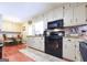 Efficient kitchen offers light cabinetry, granite counters, and eat-in breakfast nook at 395 Moss Ferry Rd, Villa Rica, GA 30180