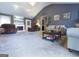 Spacious living room has vaulted ceiling and fireplace with adjacent outdoor access at 395 Moss Ferry Rd, Villa Rica, GA 30180