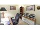The home office features custom shelving, decor, and comfortable seating for a productive workspace at 395 Moss Ferry Rd, Villa Rica, GA 30180