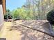 The landscaped backyard includes a rock feature and a small wooden bridge, adding character to the outdoor space at 108 Stonecrest Dr, Carrollton, GA 30116