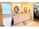 Bathroom featuring a double vanity, natural light, and a soaking tub at 108 Stonecrest Dr, Carrollton, GA 30116