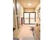 Hall bathroom with a shower-tub combination enclosed by a sliding glass door and neutral tile flooring at 108 Stonecrest Dr, Carrollton, GA 30116