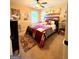 Bedroom with ceiling fan, bed and lots of wall decor at 108 Stonecrest Dr, Carrollton, GA 30116