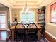 Inviting dining space features a large window and a tray ceiling, perfect for gatherings and meals at 108 Stonecrest Dr, Carrollton, GA 30116