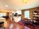 Well-lit kitchen flowing into the dining room area, featuring modern appliances and hardwood flooring throughout at 108 Stonecrest Dr, Carrollton, GA 30116