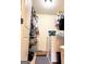 Functional laundry room with washer, dryer, and storage shelves at 108 Stonecrest Dr, Carrollton, GA 30116