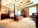 Main bedroom boasts trey ceiling and a four-poster bed at 108 Stonecrest Dr, Carrollton, GA 30116