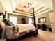 Bedroom featuring a trey ceiling, a four-poster bed, and abundant natural light at 108 Stonecrest Dr, Carrollton, GA 30116
