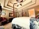 Spacious bedroom with trey ceiling, four poster bed, and stylish furnishings at 108 Stonecrest Dr, Carrollton, GA 30116