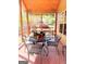 Enjoy outdoor dining on this cozy screened-in patio with a round table and comfortable seating at 108 Stonecrest Dr, Carrollton, GA 30116