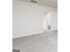 Neutral carpeted hallway featuring white walls, trim, and doorways at 307 Limestone Circle, Conyers, GA 30013