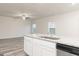 Modern kitchen features stainless steel appliances and large island with granite countertops at 307 Limestone Circle, Conyers, GA 30013