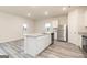 Open-concept kitchen featuring granite countertops, stainless steel appliances, and center island at 307 Limestone Circle, Conyers, GA 30013
