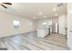 Open-concept kitchen with stainless steel appliances, center island, and vinyl flooring at 307 Limestone Circle, Conyers, GA 30013