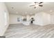 Open-concept kitchen with stainless steel appliances, center island, and vinyl flooring at 307 Limestone Circle, Conyers, GA 30013