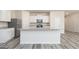Stylish kitchen with granite countertops, stainless steel appliances, and center island at 307 Limestone Circle, Conyers, GA 30013