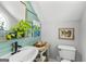 Stylish half-bathroom with modern sink, fixtures, and decorative accents that complement the room's aesthetic at 217 Christina Ct, Peachtree City, GA 30269