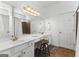 Bathroom with vanity area, ample lighting, framed mirror, tub with shower and tile flooring at 217 Christina Ct, Peachtree City, GA 30269