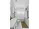 Cozy bathroom with a single sink vanity, overhead storage, and shower curtain at 217 Christina Ct, Peachtree City, GA 30269