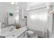 Neat bathroom with a single sink vanity, storage cabinet, and shower with curtain at 217 Christina Ct, Peachtree City, GA 30269