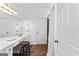 Bathroom with vanity area, ample lighting, framed mirror, and tile flooring at 217 Christina Ct, Peachtree City, GA 30269