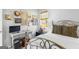 Cozy bedroom featuring a metal bed frame, wooden window blinds, and decorative wall art at 217 Christina Ct, Peachtree City, GA 30269